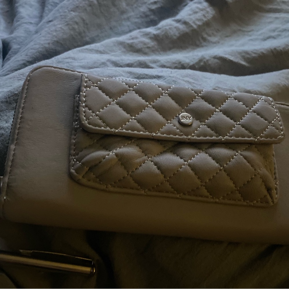 selling a Jones New York wallet with a stylish pen. message me with any details.